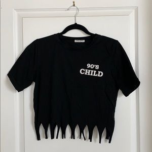 Cropped fringed black shirt.